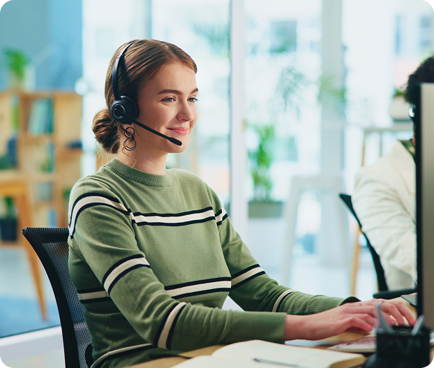 Professional insurance agent with headset at desk